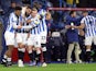 Huddersfield Town's Alex Vallejo celebrates scoring their first goal with teammates on September 28, 2021