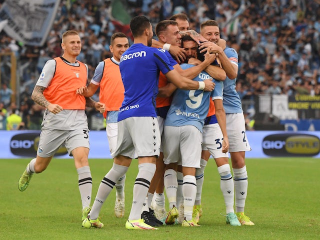 Lazio's Pedro celebrates scoring their second goal with teammates on September 26, 2021