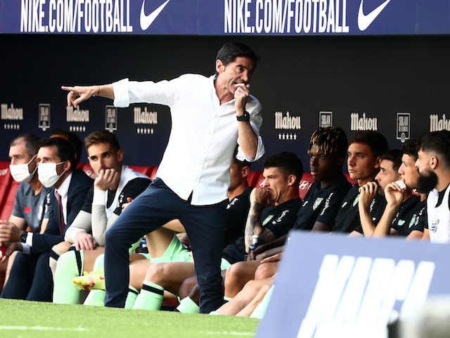 Athletic Bilbao coach Marcelino talks to teammates at the bench on September 18, 2021