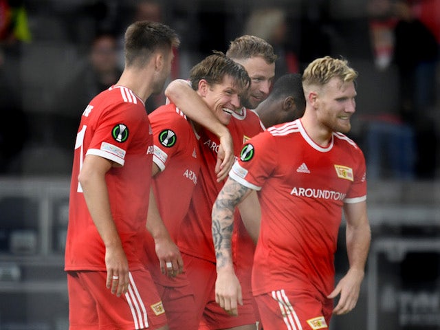 Union Berlin's Kevin Behrens celebrates scoring their second goal with teammates on September 30, 2021