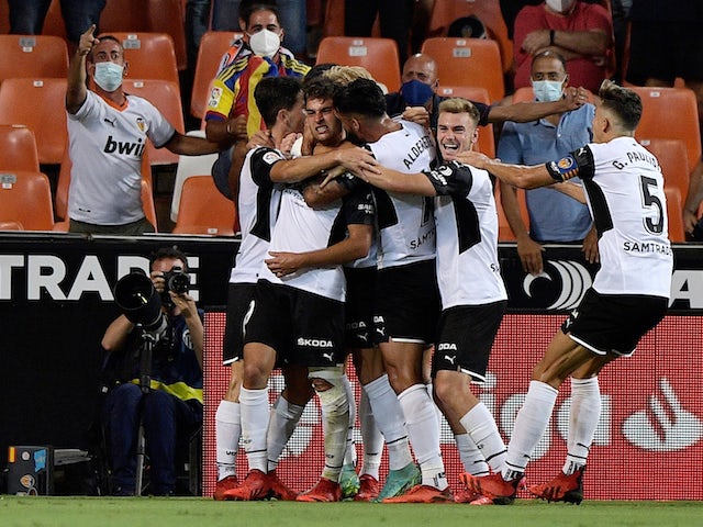 Valencia's Hugo Duro celebrates scoring their first goal with teammates on September 19, 2021