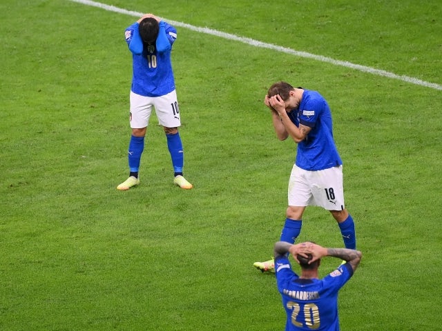 Italy's Lorenzo Insigne, Nicolo Barella and Federico Bernardeschi look dejected after defeat against Spain on October 6, 2021