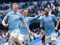 Manchester City's Kevin De Bruyne celebrates with Phil Foden and Riyad Mahrez on May 23, 2021