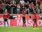 Bayer Leverkusen's Panagiotis Retsos, Odilon Kossounou and Amine Adli look dejected during the match on October 17, 2021