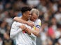 Fulham's Antonee Robinson celebrates scoring their fourth goal with Tim Ream on October 16, 2021