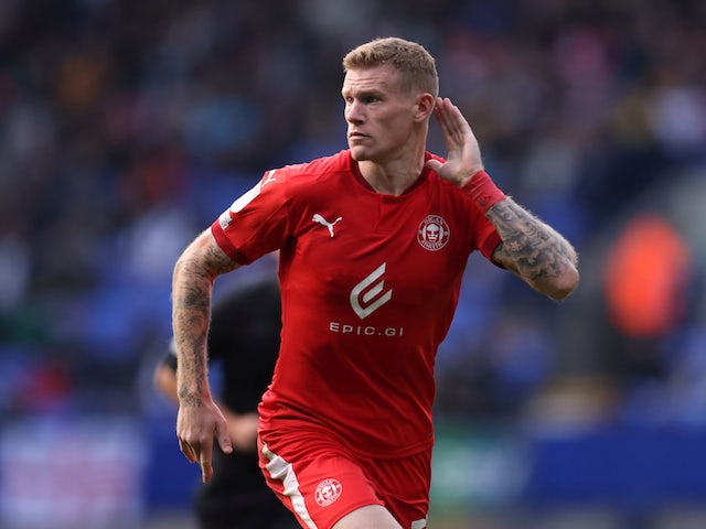 Wigan Athletic's James McClean celebrates scoring their second goal on October 16, 2021