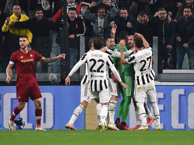 Juventus' Wojciech Szczesny celebrates with teammates after saving a penalty from AS Roma's Jordan Veretout on October 17, 2021