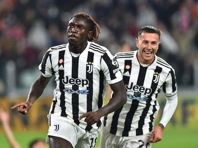 Juventus' Moise Kean celebrates scoring their first goal with Federico Bernardeschi on October 17, 2021