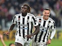 Juventus' Moise Kean celebrates scoring their first goal with Federico Bernardeschi on October 17, 2021