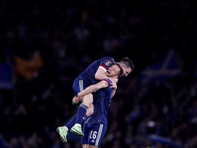 Scotland's Liam Cooper celebrates after the match with Andy Robertson on October 9, 2021