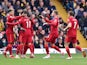 Liverpool's Sadio Mane celebrates scoring their first goal with teammates on October 16, 2021