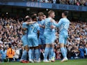 Manchester City's Bernardo Silva celebrates scoring their first goal with teammates on October 16, 2021
