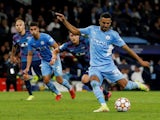 Manchester City's Riyad Mahrez scores from the penalty spot against RB Leipzig on September 15, 2021