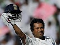 India's Sachin Tendulkar celebrates becoming the highest-ever Test run scorer on October 17, 2008.