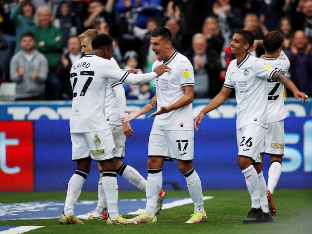 Swansea City's Joel Pillow celebrates with his teammates after scoring the second goal on 17 October 2021