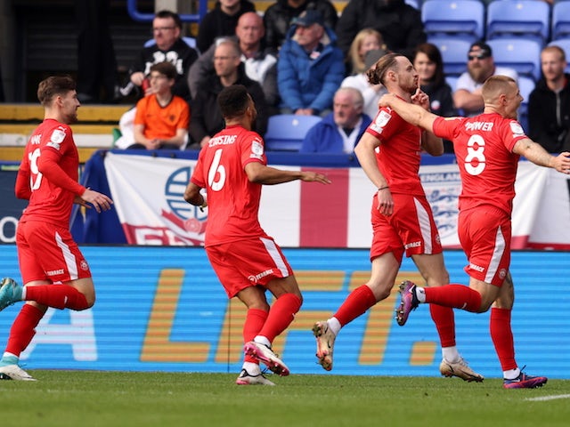 Wigan Athletic's Will Keane celebrates scoring their first goal on October 16, 2021