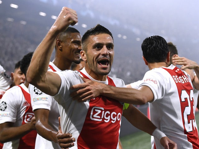 Ajax's Dusan Tadic celebrates after they score their first goal on October 19, 2021