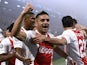 Ajax's Dusan Tadic celebrates after they score their first goal on October 19, 2021