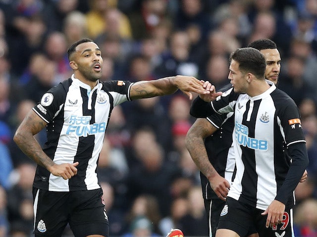 Newcastle United's Callum Wilson celebrates scoring their first goal with Javier Manquillo and Jamaal Lascelles on October 23, 2021