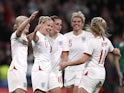 England's Bethany Mead celebrates scoring their third goal with teammates on October 23, 2021