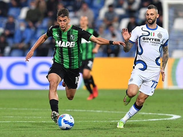 Sassuolo's Filip Duricic in action with Inter Milan's Marcelo Brozovic on October 2, 2021