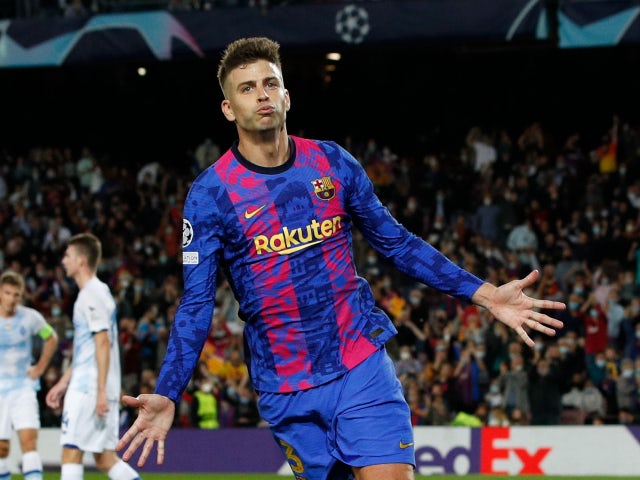 Gerard Pique celebrates scoring for Barcelona in October 2021