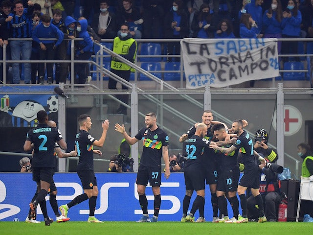 Inter Milan's Edin Dzeko celebrates scoring their first goal with teammates on October 19, 2021