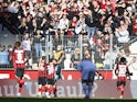 Bayer Leverkusen's Patrik Schick celebrates scoring their first goal with teammates on October 24, 2021