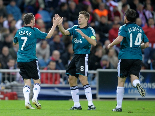 Liverpool's Robbie Keane (L) celebrates after scoring against Atletico Madrid in October 2008