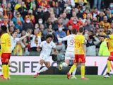 Metz's Nicolas de Preville celebrates scoring their first goal with teammates on October 24, 2021