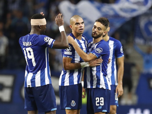 Porto's Chancel Mbemba, Joao Mario and Pepe celebrate after the match on October 19, 2021