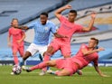 Manchester City's Raheem Sterling in action with Real Madrid's Casemiro and Toni Kroos on August 7, 2020
