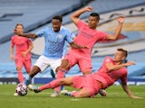 Manchester City's Raheem Sterling in action with Real Madrid's Casemiro and Toni Kroos on August 7, 2020