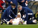 Leeds United's Raphinha receives medical attention after sustaining an injury on October 23, 2021