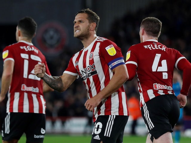 Sheffield United's Billy Sharp celebrates scoring their first goal with teammates on October 19, 2021
