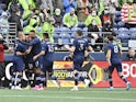 Sporting Kansas City celebrate after a goal was scored against the Seattle Sounders by Sporting Kansas City midfielder Remi Walter (54) during the first half at Lumen Field on October 23, 2021