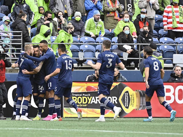 Sporting Kansas City celebrate after a goal was scored against the Seattle Sounders by Sporting Kansas City midfielder Remi Walter (54) during the first half at Lumen Field on October 23, 2021