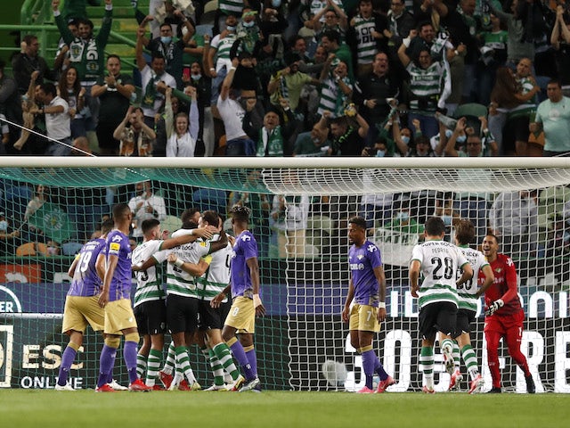 Sporting Lisbon's Sebastian Coates celebrates scoring their first goal with teammates on October 23, 2021