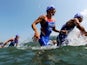 Alexander Bryukhankov (C) of Russia compete in the swimming portion of the men's triathlon at the 2008 Olympics