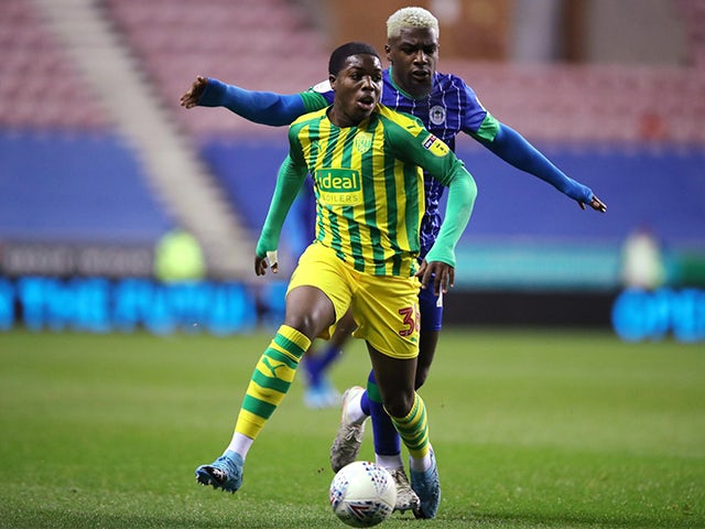  West Bromwich Albion's Nathan Ferguson in action with Wigan Athletic's Cedric Kipre on December 11, 2019