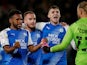 Peterborough United players celebrate after beating Hull City on October 20, 2021