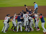Atlanta Braves players celebrate on the field after defeating the Houston Astros in game six of the 2021 World Series on November 3, 2021