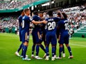 Real Madrid's Vinicius Junior celebrates scoring their first goal with teammates on October 30, 2021