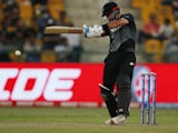 Daryl Mitchell hits a boundary during New Zealand's World T20 semi-final with England on November 10, 2021.