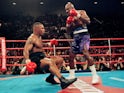 Evander Holyfield knocking down Mike Tyson in their first bout on November 9, 1996.
