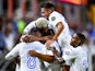 Honduras players celebrate scoring against Grenada on July 13, 2021