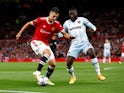 Manchester United's Diogo Dalot in action with West Ham United's Arthur Masuaku on September 22, 2021