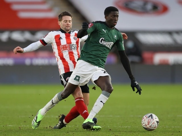  Sheffield United's Oliver Norwood in action with Plymouth Argyle's Panutche Camar