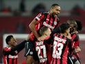 Bayer Leverkusen's Jonathan Tah and Moussa Diaby celebrate with teammates on November 4, 2021