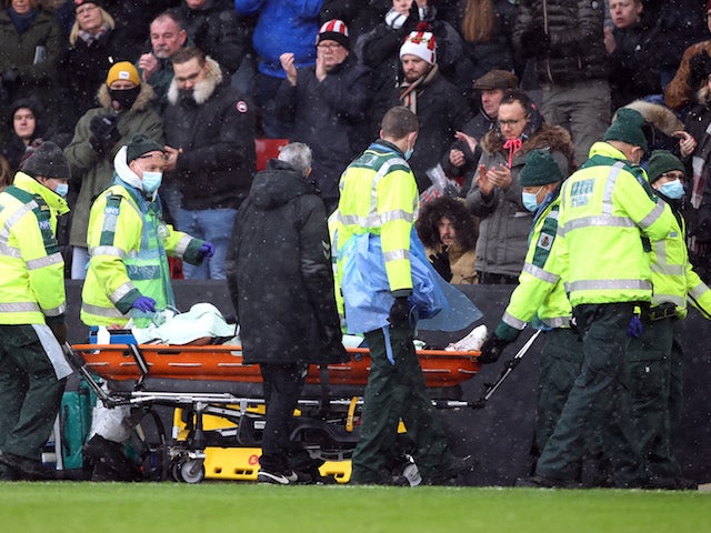Bristol City's Nathan Baker is stretchered off after sustaining an injury on November 28, 2021